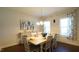 Traditional dining room with a chandelier, six chairs, and decorative curtains at 966 Airedale Trl, Garner, NC 27529