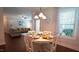 Dining room showcasing a round table with seating for four, with views into the living area at 966 Airedale Trl, Garner, NC 27529