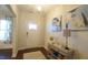 Bright entryway with light walls, stylish console table and view through the hall at 966 Airedale Trl, Garner, NC 27529