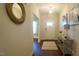 Bright entryway with light walls, stylish console table and view through the hall at 966 Airedale Trl, Garner, NC 27529