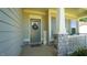 Inviting covered front porch features stone accents, decorative wreath and charming decor at 966 Airedale Trl, Garner, NC 27529