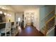 Open hallway with access to kitchen, dining area, and stairs to the upper level at 966 Airedale Trl, Garner, NC 27529