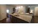 Kitchen featuring granite countertops, stainless steel appliances, and an open layout into the dining area at 966 Airedale Trl, Garner, NC 27529