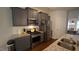 Well-appointed kitchen featuring gray cabinetry, stainless steel appliances, and granite countertops at 966 Airedale Trl, Garner, NC 27529