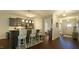 Modern kitchen features granite countertops, stainless steel appliances, and a breakfast bar with stylish seating at 966 Airedale Trl, Garner, NC 27529