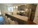 Modern kitchen boasting granite countertops, stainless steel appliances, and pendant lighting at 966 Airedale Trl, Garner, NC 27529