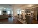 Open floor plan featuring a modern kitchen with a breakfast bar and stainless steel appliances at 966 Airedale Trl, Garner, NC 27529