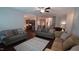 Spacious living room showcasing an open floor plan to the kitchen and stairs to the second floor at 966 Airedale Trl, Garner, NC 27529