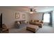 Comfortable living room with two sofas, an ottoman, and a ceiling fan at 966 Airedale Trl, Garner, NC 27529