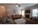 Spacious living room featuring a fireplace, comfortable seating, and a ceiling fan at 966 Airedale Trl, Garner, NC 27529