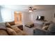 Open living space with comfortable sofas, large ottoman and TV mounted on the wall at 966 Airedale Trl, Garner, NC 27529