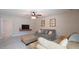 Spacious living room with TV, comfortable seating, and modern decor at 966 Airedale Trl, Garner, NC 27529