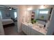 Stylish main bathroom boasts double sinks, a spacious vanity, and views to the bedroom and bath at 966 Airedale Trl, Garner, NC 27529