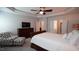 Spacious main bedroom features tray ceiling, fan, and ensuite bath with walk-in closet access at 966 Airedale Trl, Garner, NC 27529