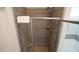 Modern shower featuring gray tiles, a built-in bench, and modern fixtures next to the soaking tub at 966 Airedale Trl, Garner, NC 27529