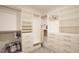 Organized walk-in closet with built-in shelving and drawers for ample storage at 966 Airedale Trl, Garner, NC 27529