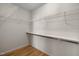 A standard walk-in closet with built-in shelves and hanging rods, providing ample storage at 100 W Acres Cres, Cary, NC 27519