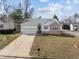 Charming single-Gathering home with attached garage, well-maintained lawn, and inviting front entrance at 100 W Acres Cres, Cary, NC 27519