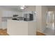 Modern kitchen featuring stainless steel appliances, breakfast bar, and light colors at 100 W Acres Cres, Cary, NC 27519