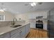 Kitchen featuring stainless steel appliances, granite counters, and white cabinetry at 100 W Acres Cres, Cary, NC 27519
