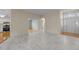 Spacious living room with an open floor plan, stylish flooring, and plenty of natural light at 100 W Acres Cres, Cary, NC 27519