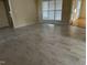 Living room with tile flooring, big windows, and ample natural light at 100 W Acres Cres, Cary, NC 27519