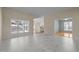 Bright living room featuring tile floors, large windows, and neutral wall colors at 100 W Acres Cres, Cary, NC 27519