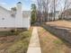 Sidewalk and landscaping on the side of the home at 100 W Acres Cres, Cary, NC 27519