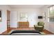 Stylishly furnished bedroom with decor, rug, and hardwood floors, offering a cozy and inviting space at 1002 Willow Drive # 63, Chapel Hill, NC 27514