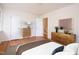 Staged bedroom featuring a comfortable bed, coordinating furniture, and hardwood floors at 1002 Willow Drive # 63, Chapel Hill, NC 27514