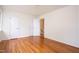 Spacious bedroom with hardwood floors, white trim, and multiple closets at 1002 Willow Drive # 63, Chapel Hill, NC 27514
