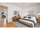 Stylish bedroom with a large bed, chic furniture, and warm hardwood floors at 1002 Willow Drive # 63, Chapel Hill, NC 27514