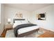 Well-appointed bedroom showcasing modern decor, plush bedding, and hardwood floors for a comfortable retreat at 1002 Willow Drive # 63, Chapel Hill, NC 27514