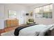 Staged bedroom with a cozy bed, dresser, and great natural light at 1002 Willow Drive # 63, Chapel Hill, NC 27514