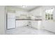 Functional kitchen with white cabinets, modern appliances, and ample counter space at 1002 Willow Drive # 63, Chapel Hill, NC 27514