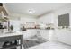 Bright kitchen featuring white cabinetry, appliances, and countertops at 1002 Willow Drive # 63, Chapel Hill, NC 27514