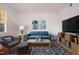 Comfortable living room features modern decor, a stylish sofa, and an accent chair at 1002 Willow Drive # 63, Chapel Hill, NC 27514