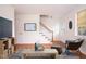 Staged living room with wood floors, stairs, stylish decor, and a comfortable seating area at 1002 Willow Drive # 63, Chapel Hill, NC 27514