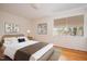 Bedroom features hardwood floors, large window, and stylish furnishings at 1002 Willow Drive # 63, Chapel Hill, NC 27514