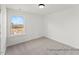 Bright bedroom with a neutral color palette and a large window offering natural light at 106 S Buggy Dr # 70, Benson, NC 27504