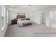 Spacious primary bedroom featuring tray ceilings, neutral colors, and an en-suite bath at 106 S Buggy Dr # 70, Benson, NC 27504