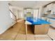 Bright kitchen featuring white cabinets, a large island, and stairs leading to the second floor at 1079 Fairhaven Dr # 50, Mebane, NC 27302