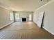 Spacious living room features a fireplace, backyard access and lots of light at 1079 Fairhaven Dr # 50, Mebane, NC 27302
