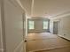Main bedroom with tray ceiling, natural light and carpet protection at 1079 Fairhaven Dr # 50, Mebane, NC 27302