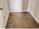 Walk-in closet featuring gray tile flooring and white trim at 1079 Fairhaven Dr # 50, Mebane, NC 27302