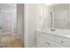 Well-lit bathroom featuring a vanity, sink, tile floor, and a shower-tub combination at 1096 Silverleaf Dr, Youngsville, NC 27596