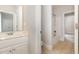 Well-lit bathroom featuring a vanity, sink, tile floor, and a shower-tub combination at 1096 Silverleaf Dr, Youngsville, NC 27596