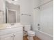 Bright bathroom with white vanity, tiled floor, toilet and shower-tub combo at 1096 Silverleaf Dr, Youngsville, NC 27596