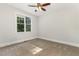 Light bedroom with carpet, ceiling fan, and bright window at 1096 Silverleaf Dr, Youngsville, NC 27596