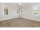 Spacious bedroom with neutral carpet, a ceiling fan, and plenty of natural light at 1096 Silverleaf Dr, Youngsville, NC 27596